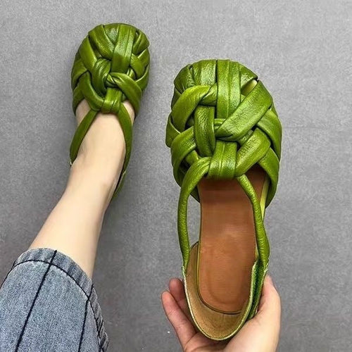 Close-up of satin feel unique woven sandals in dark brown, showing cross-weave design and secure heel strap