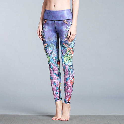 Woman wearing Queen skinny stretch yoga pants with animal pattern in active pose