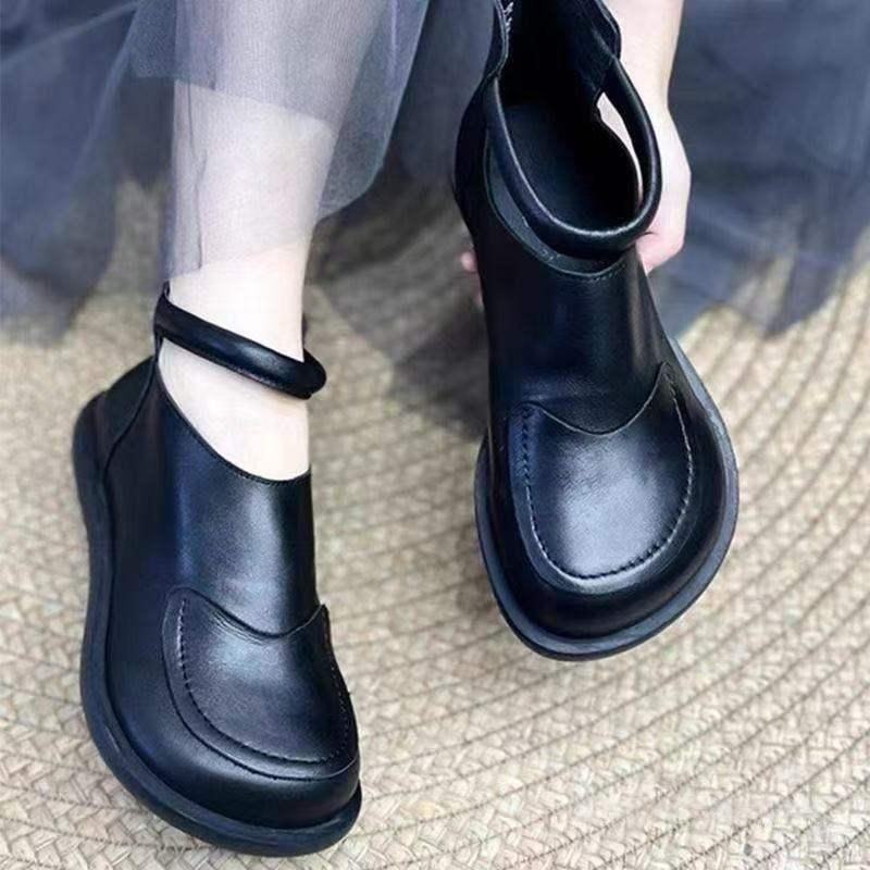 Black leather shoe with cross-laced wrap closure for comfortable daily walking