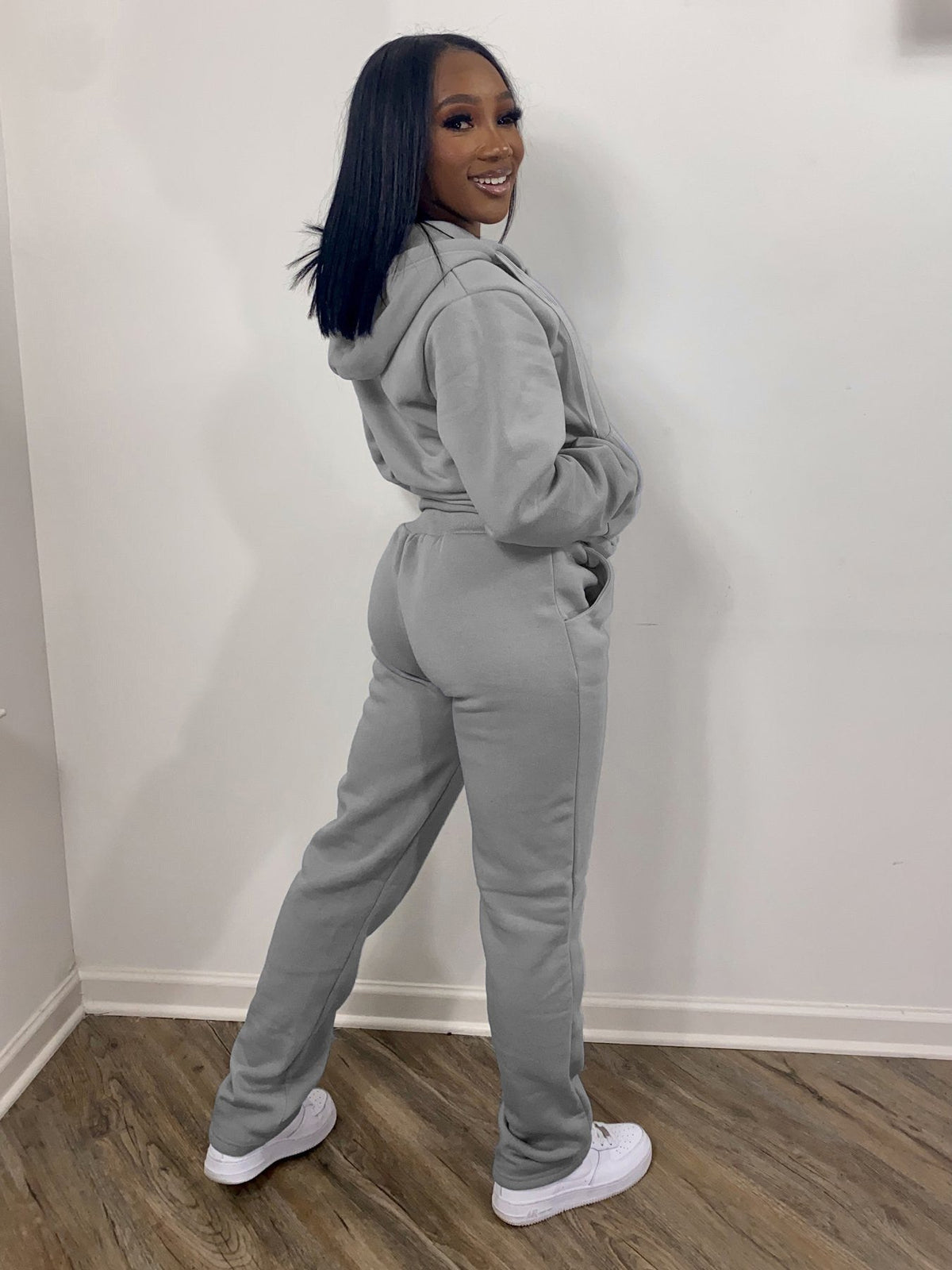 Two-piece brushed polyester fleece athletic set with hoodie and straight-leg pants in heather gray, showcasing Tease 'Em With The Goodies streetwear style.