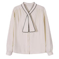 Apricot niche retro loose chiffon blouse with navy collar and long sleeves on model