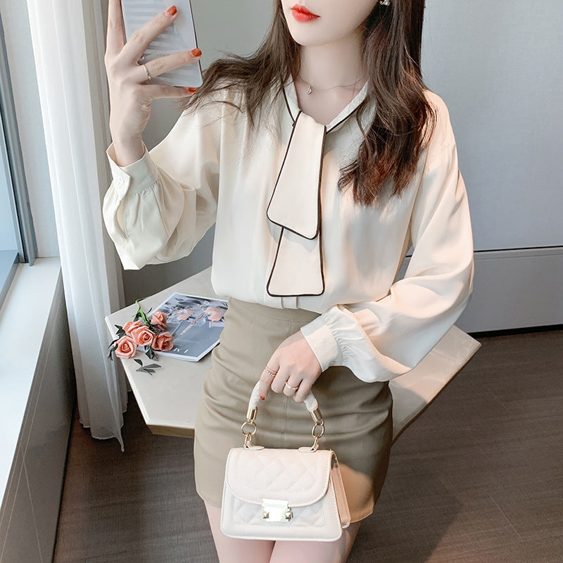 Apricot niche retro loose chiffon blouse with navy collar and full-length sleeves displayed on woman