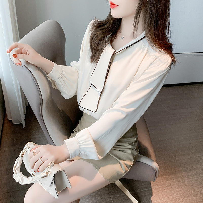 Women modeling niche retro loose apricot chiffon blouse with navy collar and long sleeves
