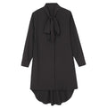 Long-sleeve chiffon blazer styled over nude hosiery and leggings for autumn city wear