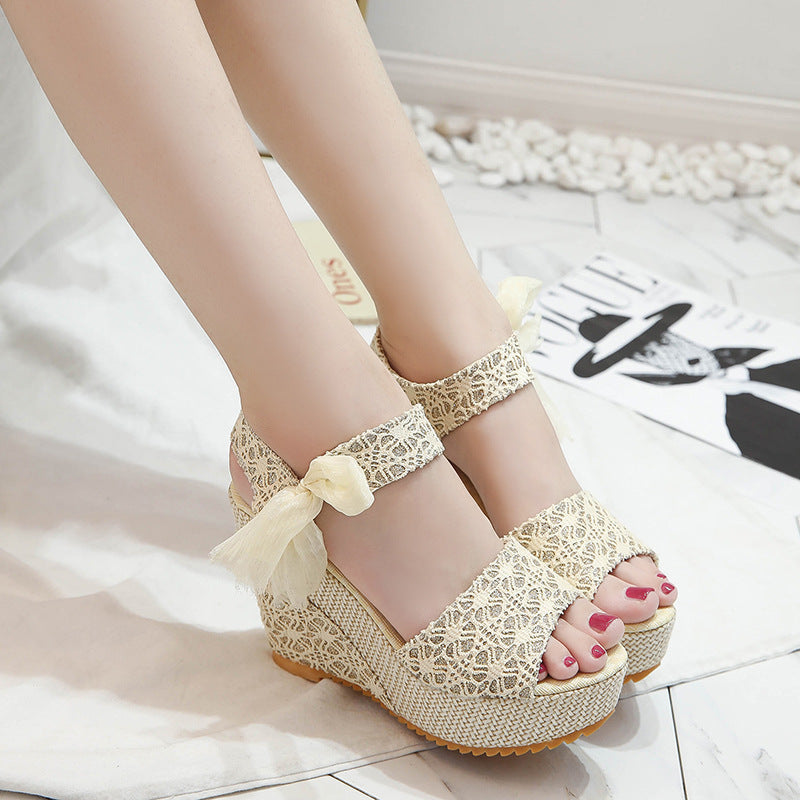 Gorgeous pair of espadrilles with padded faux-leather footbed, floral satin ribbons, cross-strap, narrow wedge, and ventilated cotton uppers