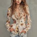 Woman wearing a slim-fit polyester-knit pullover with floral motif and lightweight knit fabric