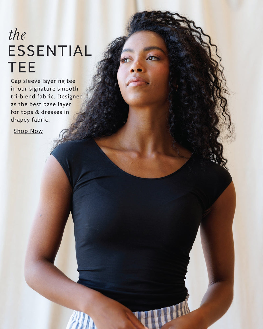 Close-up of a breathable Essential Tee with cap sleeves and scoop neckline in light grey