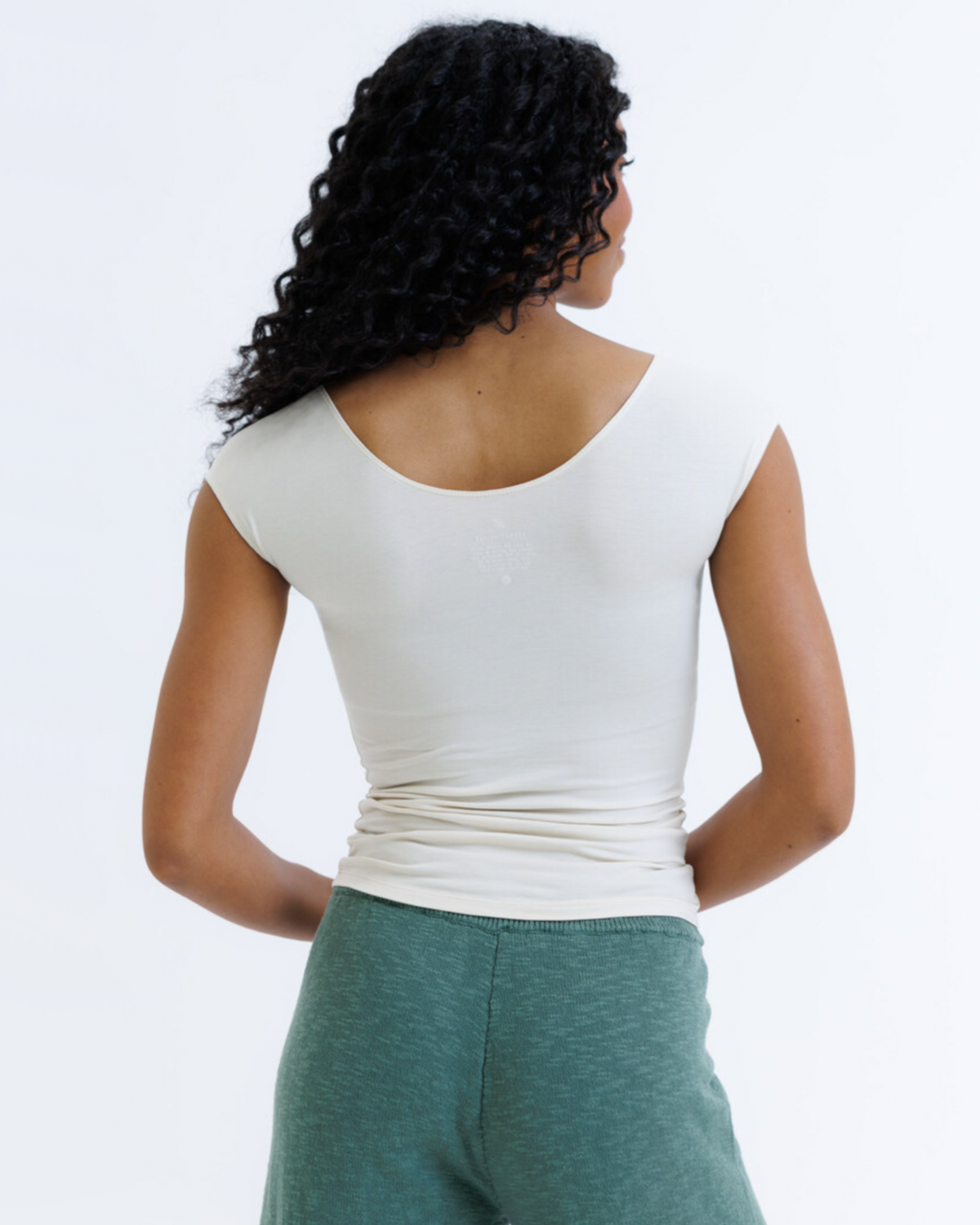 Breathable Essential Tee with cap sleeves and scoop neckline in neutral color for everyday wear