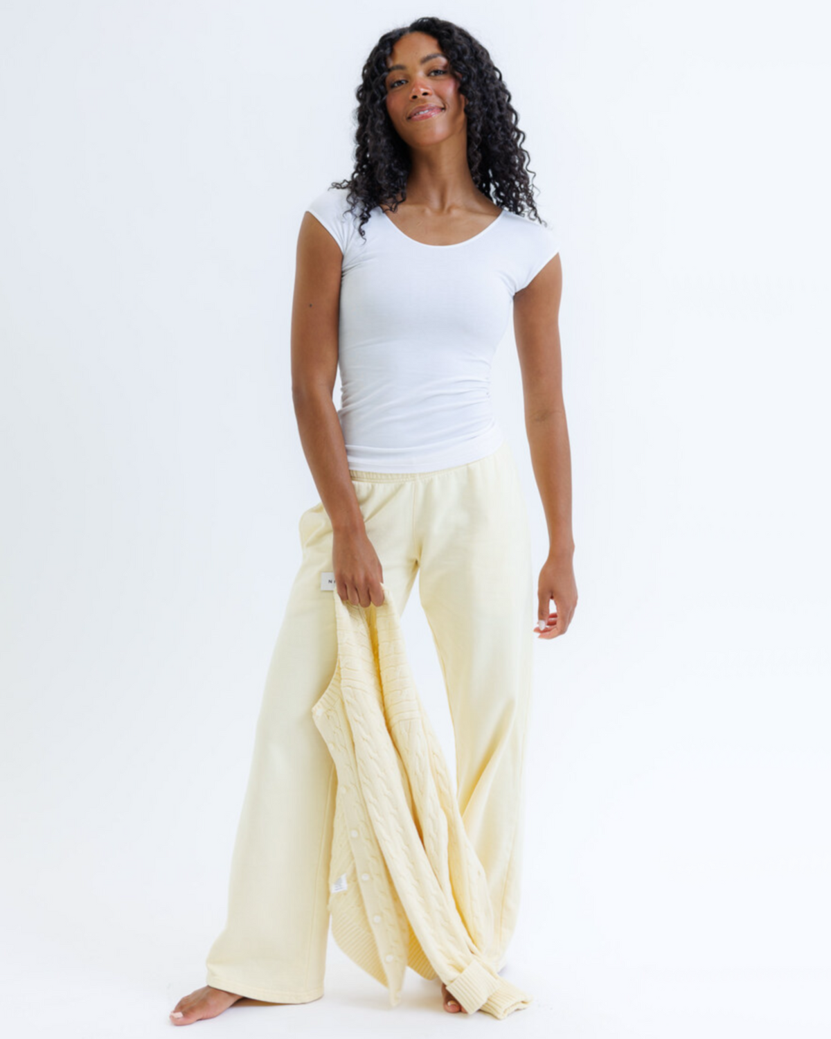Essential tee in breathable cotton blend with cap sleeves and scoop neckline for a sleek fit