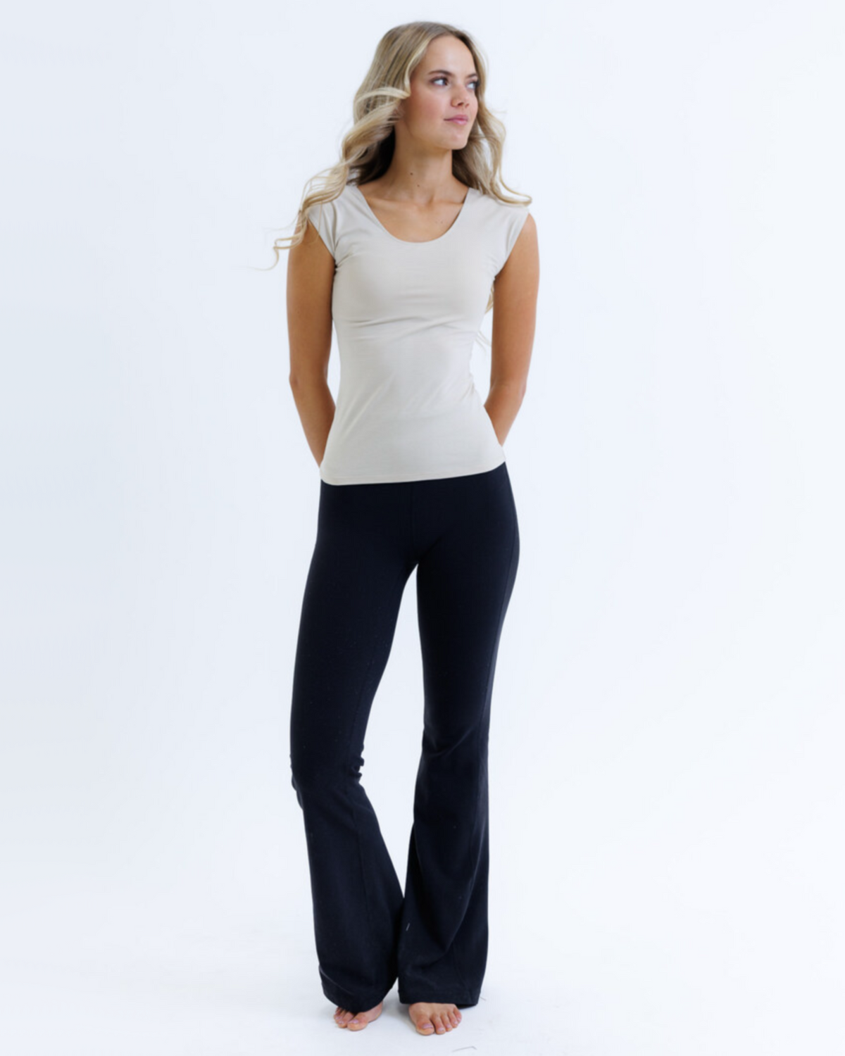 White essential tee with cap sleeves and scoop neckline, breathable cotton-modal blend, perfect under blazers and knitwear