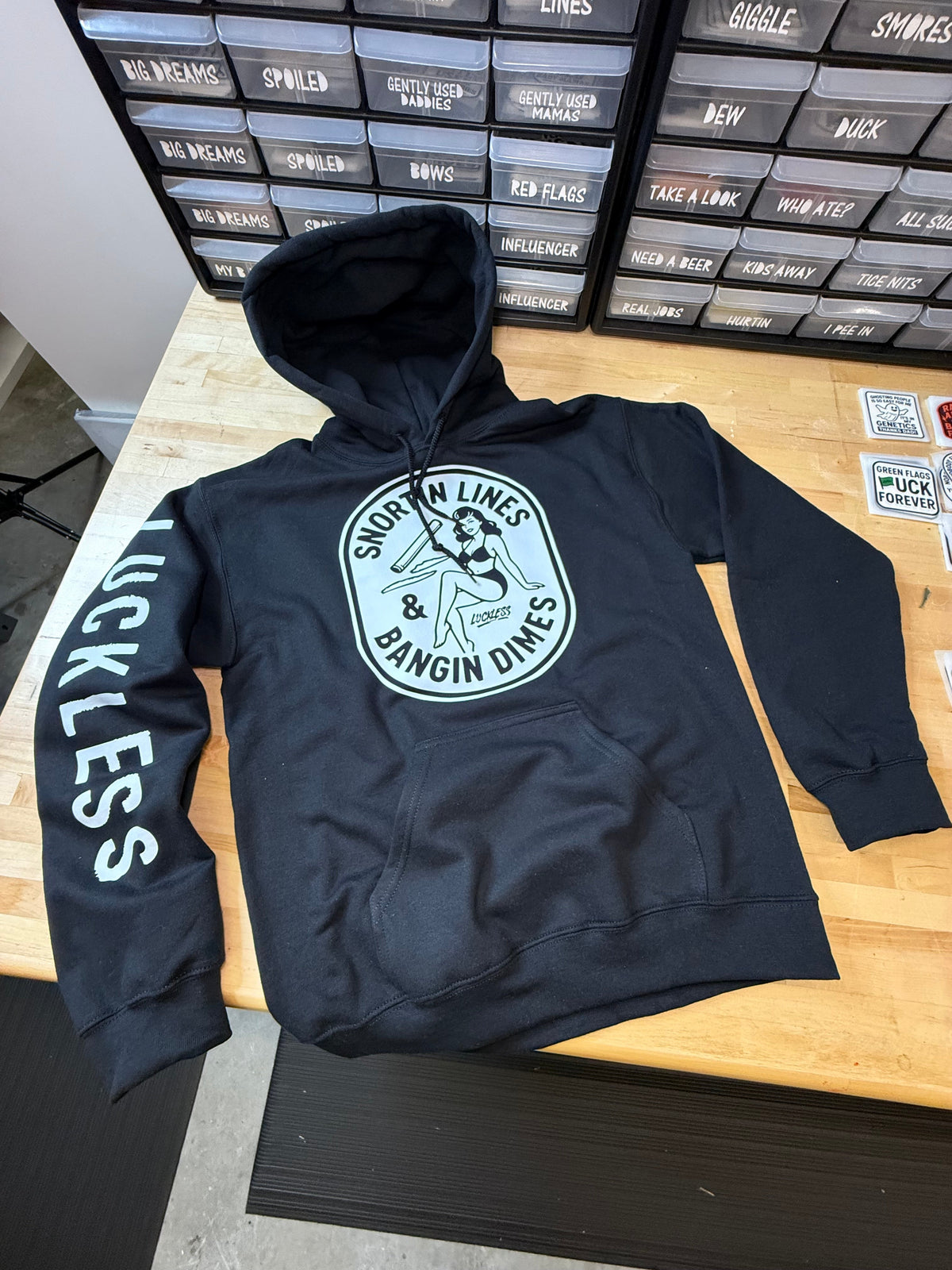 Black Lines and Dimes Hoodie with vintage pin-up graphic and Luckless branding for men