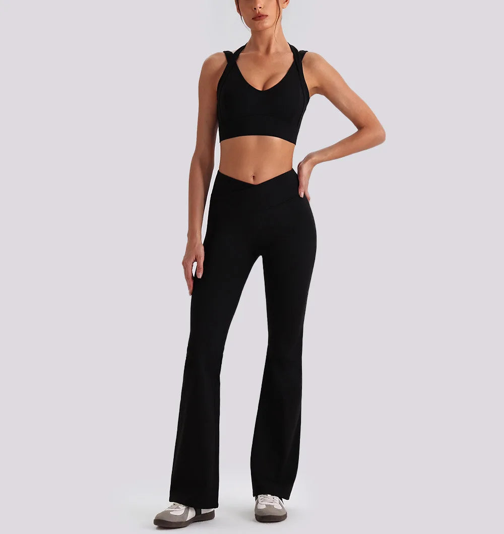 Women wearing backless V-neck sports tank top and high waist wide leg pants yoga exercise set