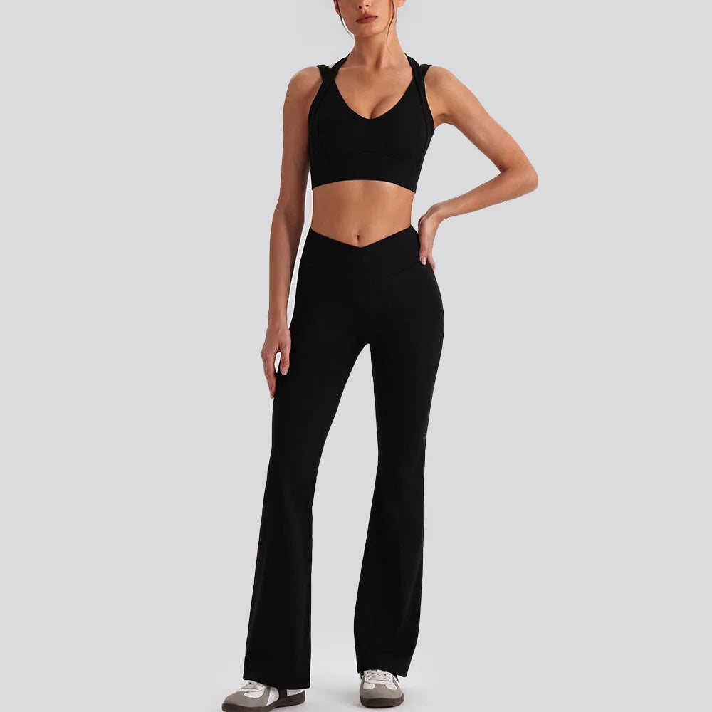 Women's yoga exercise set with backless sports tank top and high waist wide leg pants