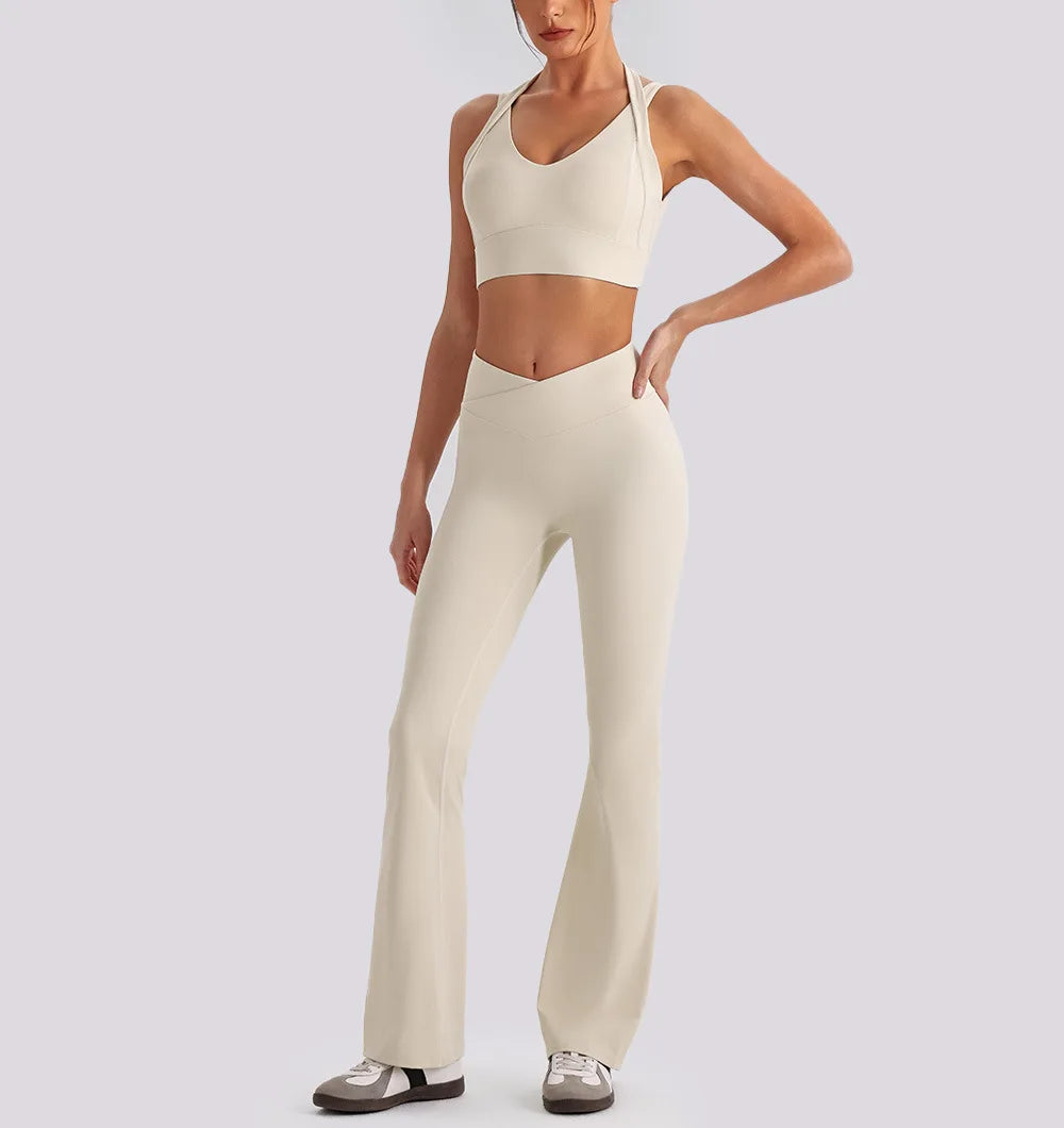 Women's yoga exercise set with backless sports tank top and high waist wide leg pants for gym and running