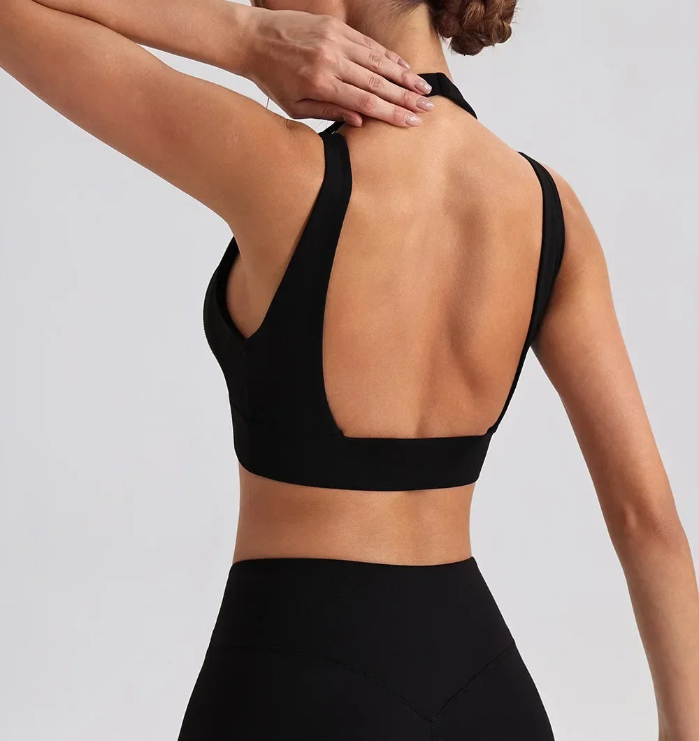 Women's yoga exercise set with backless V-neck tank and high-waist wide-leg pants for gym and running