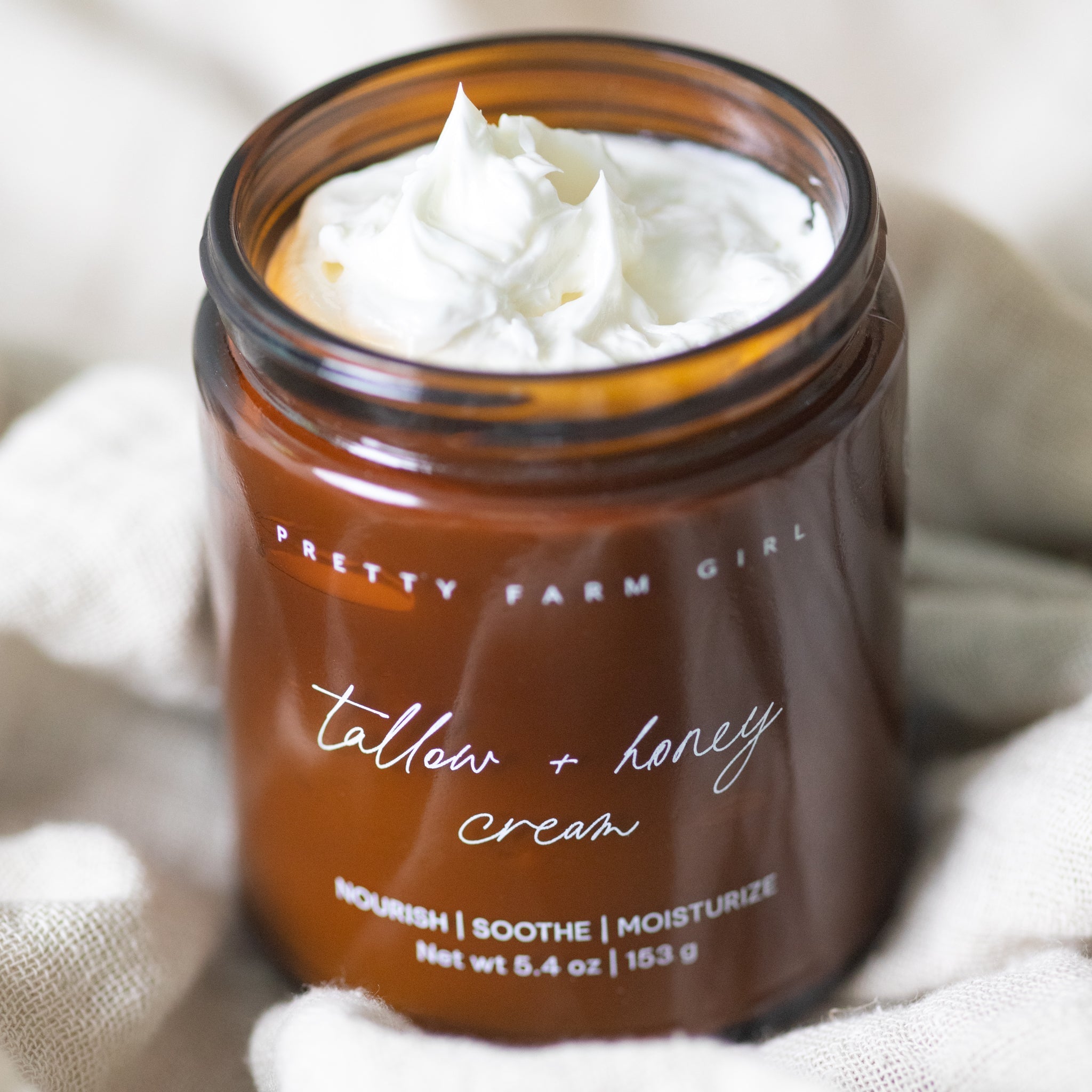 Pure + Simple Skin Kit with fragrance-free tallow body butter and probiotic goat milk soap for sensitive skin in amber glass jar and soap bar packaging