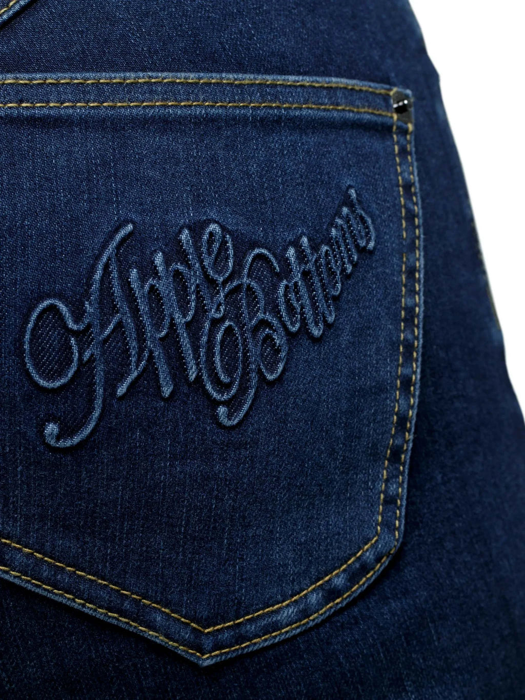 Close-up of Apple Bottoms brand thong denim jeans stitching and posterior detail