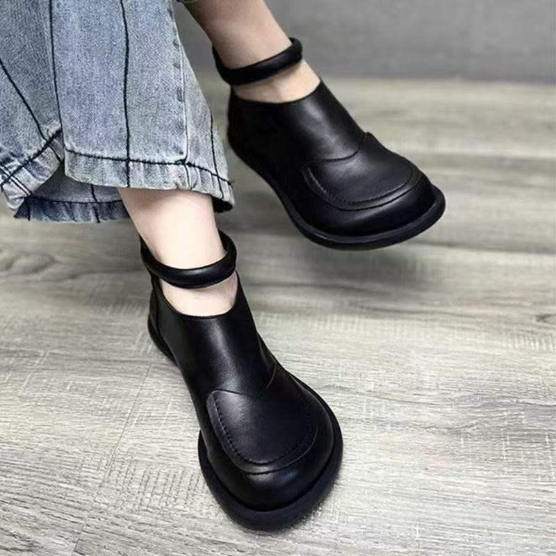 Black leather shoe with cross-laced wrap closure for comfortable daily walking