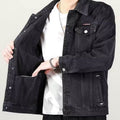 Mens stylish vintage distressed denim jacket with long sleeves and classic fit on white background