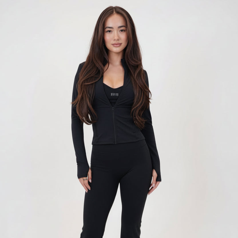 I Live in Luxury Flare Pant in black quick-dry nylon-spandex with high-rise waist and soft flare hem on model