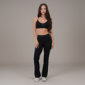 I Live in Luxury Flare Pant in black high-rise nylon and spandex with a soft flare leg and quick-dry performance fit