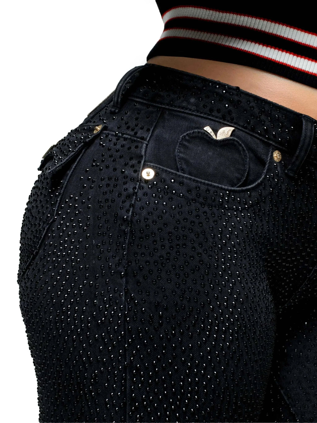 Model wearing Apple Bottoms Rain on Me Jeans with 3D raindrop print and rhinestone flap pockets paired with Nelly varsity jacket